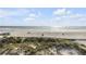 Panoramic view of the beach showing sand dunes and blue ocean waters at 951 N Atlantic Ave, New Smyrna Beach, FL 32169