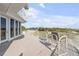 Balcony with beach views and comfortable seating at 951 N Atlantic Ave, New Smyrna Beach, FL 32169