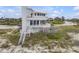 Charming coastal home with multiple balconies, great natural light, and beach access at 951 N Atlantic Ave, New Smyrna Beach, FL 32169