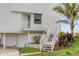 A charming beach house showcasing its unique architectural details and landscaping at 951 N Atlantic Ave, New Smyrna Beach, FL 32169