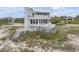 Beautiful, modern home on a sandy beach, showcasing multiple decks and gorgeous views at 951 N Atlantic Ave, New Smyrna Beach, FL 32169