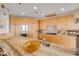 Gourmet kitchen with custom cabinets, granite countertops, stainless steel appliances, and ocean views at 951 N Atlantic Ave, New Smyrna Beach, FL 32169