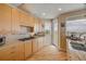 Bright kitchen equipped with stainless appliances, stone countertops, and direct access to outside deck at 951 N Atlantic Ave, New Smyrna Beach, FL 32169