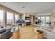 Bright living room with floor-to-ceiling windows, piano and panoramic ocean views at 951 N Atlantic Ave, New Smyrna Beach, FL 32169