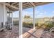 Outdoor patio with chairs and a fenced yard, perfect for relaxation at 951 N Atlantic Ave, New Smyrna Beach, FL 32169