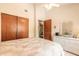 Bright bedroom with white wicker furniture, ceiling fan and a large closet with wood sliding doors at 98 Cypress Pond Rd, Port Orange, FL 32128