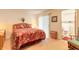Bedroom view featuring the bed, slider to the lanai, and a doorway to the bathroom at 98 Cypress Pond Rd, Port Orange, FL 32128