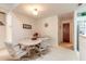 Cozy dining area features a round table with four rolling chairs and a neutral color palette at 98 Cypress Pond Rd, Port Orange, FL 32128