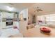 Bright, combined living and dining area with a view into the kitchen at 98 Cypress Pond Rd, Port Orange, FL 32128