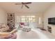Cozy living room with a ceiling fan and well-lit sitting area near the entrance at 98 Cypress Pond Rd, Port Orange, FL 32128