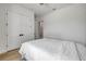 Bright bedroom features wood floors, closet and all white walls at 102 Inlet Shores Dr, New Smyrna Beach, FL 32168