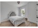 Well-lit bedroom featuring a comfortable bed and lots of natural light at 102 Inlet Shores Dr, New Smyrna Beach, FL 32168