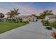 Stunning single Gathering home with a gorgeous entry and lush tropical landscaping including palm trees at 102 Inlet Shores Dr, New Smyrna Beach, FL 32168