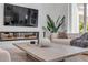 Living room close-up featuring a modern fireplace, stylish decor, and herringbone wood floors at 102 Inlet Shores Dr, New Smyrna Beach, FL 32168