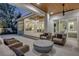 Inviting outdoor living area with comfortable seating, a fire pit, and seamless access to the indoors at 102 Inlet Shores Dr, New Smyrna Beach, FL 32168