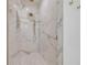 Luxurious shower featuring an updated fixture, marble tile, and modern design at 102 Inlet Shores Dr, New Smyrna Beach, FL 32168