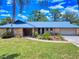 An aerial view of the property showcasing the metal roof and surrounding landscape at 108 Dee St, New Smyrna Beach, FL 32168