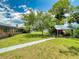 Expansive backyard featuring a covered patio, perfect for outdoor entertaining and relaxation at 108 Dee St, New Smyrna Beach, FL 32168