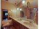 Bright bathroom featuring a double sink vanity with a marble countertop and decorative lighting at 108 Dee St, New Smyrna Beach, FL 32168