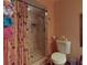 Attached bath with walk-in shower and grab bar for accessibility at 108 Dee St, New Smyrna Beach, FL 32168