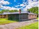Spacious single-story brick home with a screened patio for enjoying outdoor living at 108 Dee St, New Smyrna Beach, FL 32168