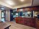 Cozy kitchen features wood floors, stone fireplace and plenty of countertop space at 108 Dee St, New Smyrna Beach, FL 32168