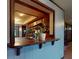 View of the kitchen through the breakfast bar featuring wood cabinets and recessed lighting at 108 Dee St, New Smyrna Beach, FL 32168