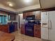 Kitchen with appliances and breakfast bar at 108 Dee St, New Smyrna Beach, FL 32168