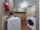 The laundry room has extra storage and washer and dryer at 108 Dee St, New Smyrna Beach, FL 32168
