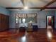 Open living area showcasing wood floors and beamed ceilings at 108 Dee St, New Smyrna Beach, FL 32168
