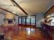 Living room with stone fireplace and sliding glass doors to exterior at 108 Dee St, New Smyrna Beach, FL 32168