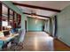 Bright and spacious room with hardwood floors, wood beams and large windows at 108 Dee St, New Smyrna Beach, FL 32168