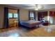 Spacious main bedroom with hardwood floors, ceiling fan and a lounge area at 108 Dee St, New Smyrna Beach, FL 32168