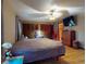 Comfortable main bedroom with ceiling fan and closet space at 108 Dee St, New Smyrna Beach, FL 32168