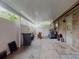 Covered patio with plenty of space for storage, tools and yard equipment at 108 Dee St, New Smyrna Beach, FL 32168