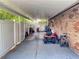Covered patio with plenty of space for storage, tools and yard equipment at 108 Dee St, New Smyrna Beach, FL 32168