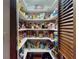Walk-in pantry featuring abundant shelving for optimal organization and storage of food and household goods at 108 Dee St, New Smyrna Beach, FL 32168