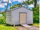 Well-maintained storage shed with a ramp providing easy access to store outdoor equipment at 108 Dee St, New Smyrna Beach, FL 32168