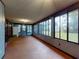 Spacious sunroom with ample windows and natural light, providing a relaxing space at 108 Dee St, New Smyrna Beach, FL 32168