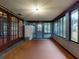 View of the sunroom, featuring door access to the backyard at 108 Dee St, New Smyrna Beach, FL 32168