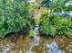 Beautiful waterfront property with mature trees and a gazebo at 108 Dee St, New Smyrna Beach, FL 32168