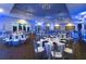Spacious ballroom with elegant lighting and neatly arranged tables ready for any event at 113 Pitching Wedge Dr, Daytona Beach, FL 32124
