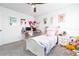 Adorable bedroom featuring neutral walls, a ceiling fan, carpeted floor and pink accents at 113 Pitching Wedge Dr, Daytona Beach, FL 32124