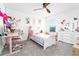 Adorable bedroom featuring neutral walls, a ceiling fan, carpeted floor and white furniture at 113 Pitching Wedge Dr, Daytona Beach, FL 32124