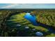 Picturesque aerial view of the golf course highlighting the water features and natural surroundings at 113 Pitching Wedge Dr, Daytona Beach, FL 32124