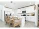 Bright, modern kitchen with stainless steel appliances, white cabinetry, and a breakfast bar at 113 Pitching Wedge Dr, Daytona Beach, FL 32124