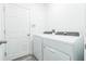 Functional laundry room with modern washer and dryer units and ample space at 113 Pitching Wedge Dr, Daytona Beach, FL 32124