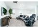 Upstairs living room featuring neutral paint, carpet, comfortable seating, mounted TV and lots of natural light at 113 Pitching Wedge Dr, Daytona Beach, FL 32124