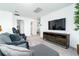 Upstairs living room featuring neutral paint, carpet, comfortable seating, mounted TV and lots of natural light at 113 Pitching Wedge Dr, Daytona Beach, FL 32124