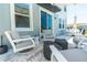 Covered patio featuring comfortable seating and stylish outdoor décor at 113 Pitching Wedge Dr, Daytona Beach, FL 32124
